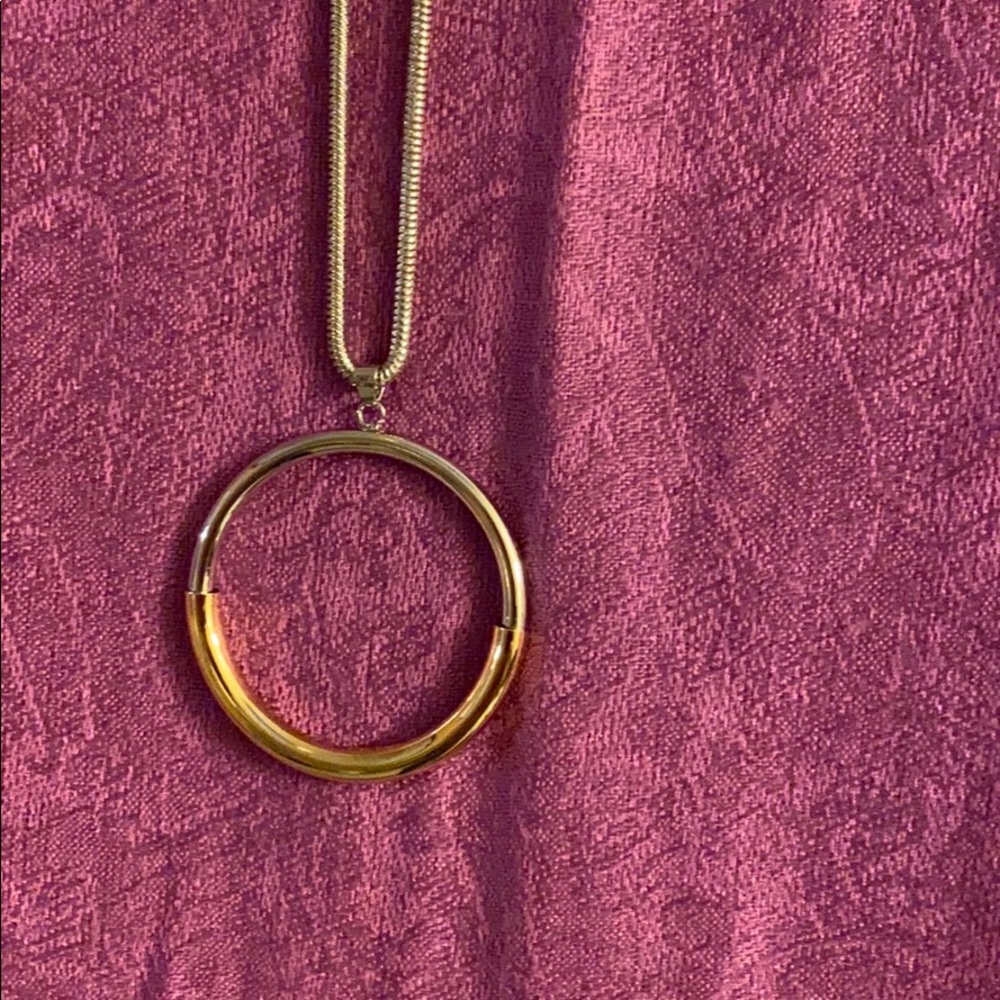 Silver necklace with silver and gold large circle